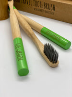 Load image into Gallery viewer, Eco Garden Celadon Green Bamboo Travel Toothbrush
